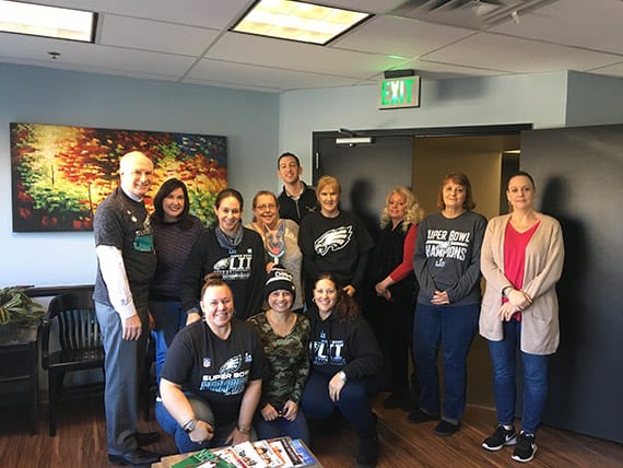 Jacobs, Schwalbe & Petruzzelli staff and attorneys in Philadelphia Eagles shirts