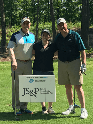 Attorneys Mark S Jacobs, Lauren S Tovinsky and Robert A Petruzzelli at at golf tournament