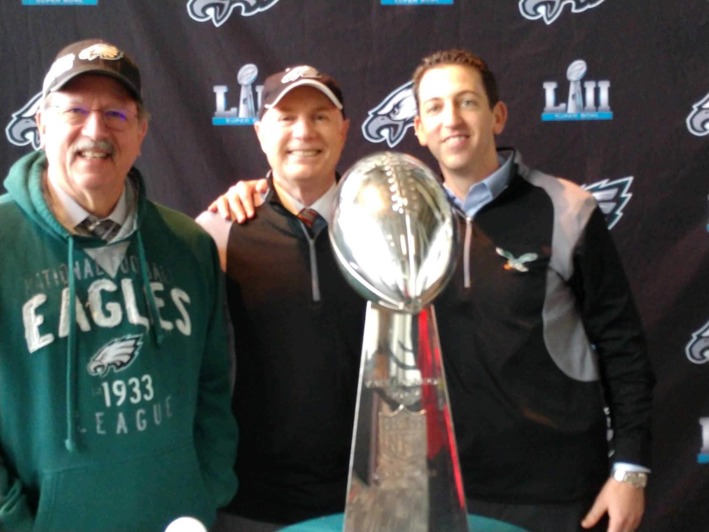 Jacobs, Schwalbe & Petruzzelli attorneys with Philadelphia Eagles' Vince Lombardi trophy